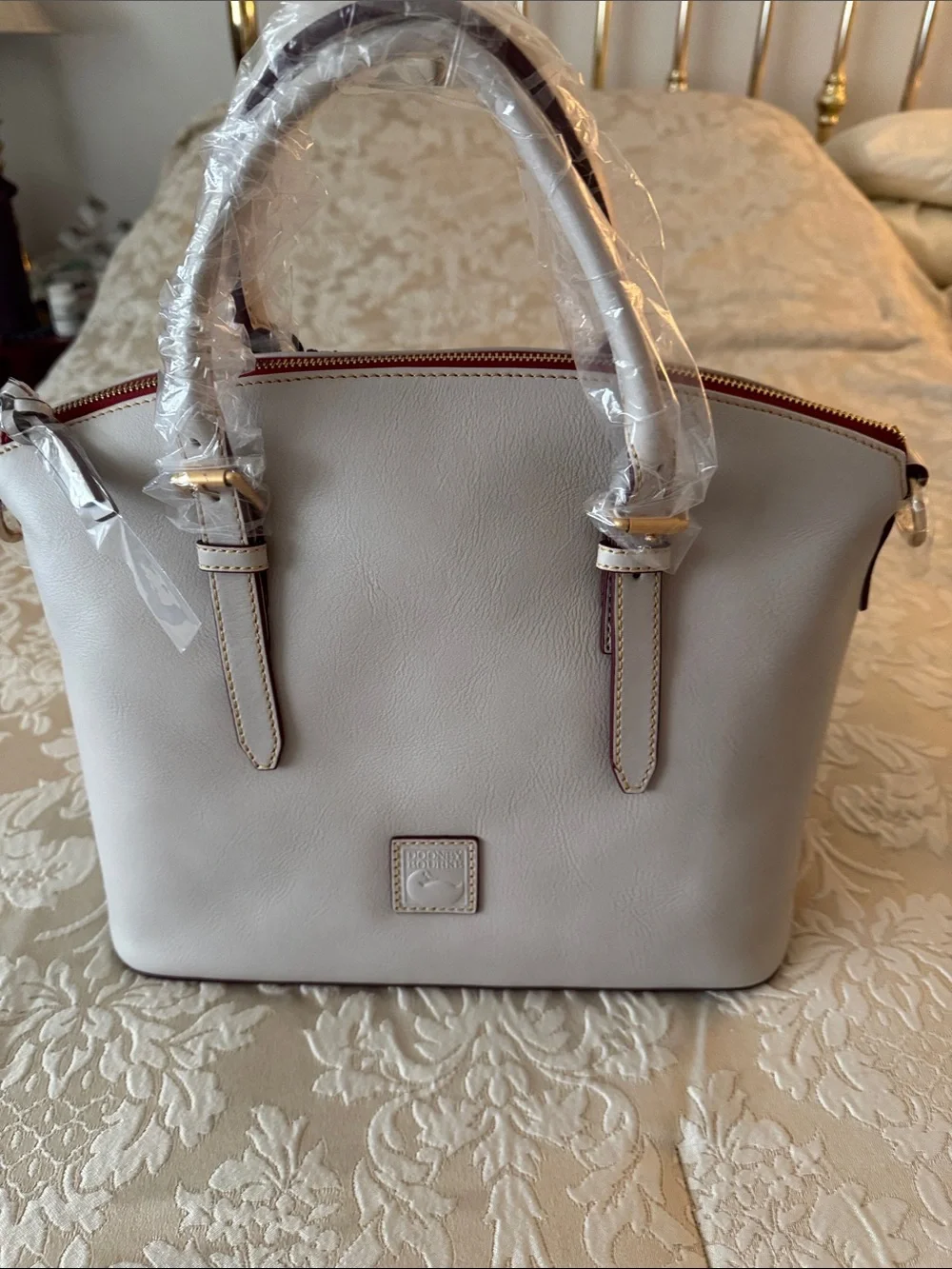 Dooney & Bourke Pebble Leather Satchel in Cream with Red Trim